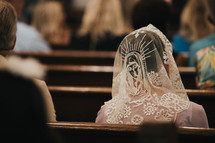 a woman wearing a veil with mother mary