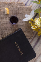communion elements on burlap and Holy Bible 