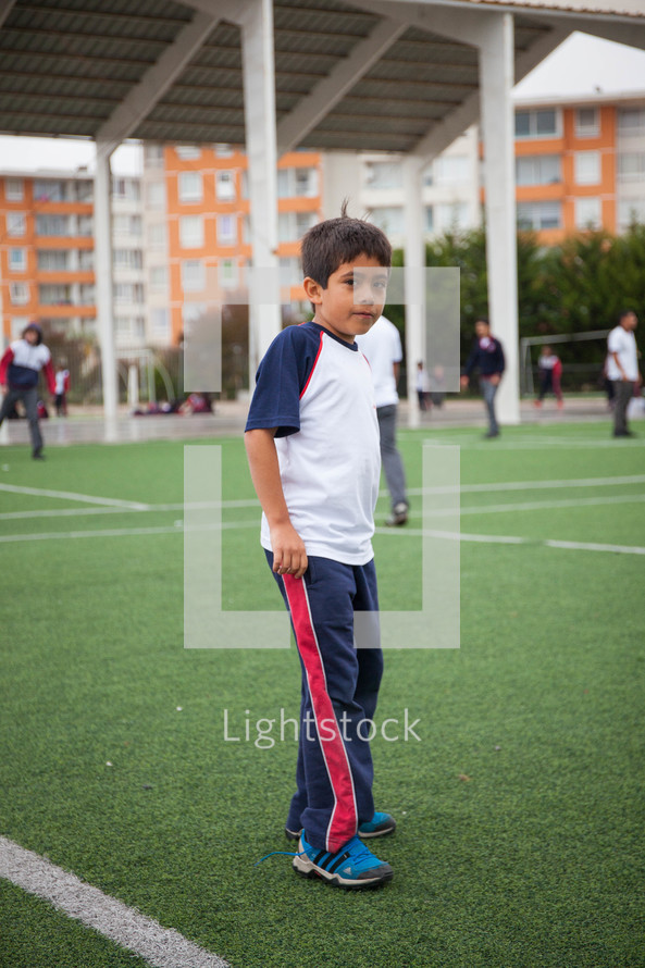 a child on a soccer field in La Serena, Chile