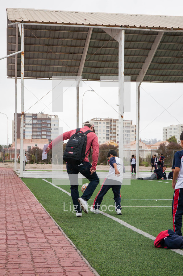 kids on a soccer field in La Serena, Chile