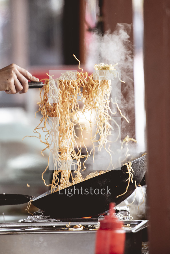 chef cooking noodles 