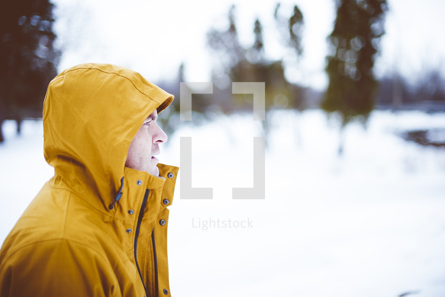 a man in a yellow coat 