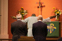 pastor presenting the offering