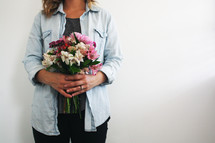 woman holding a bouquet of flowers 