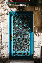 teal metal security door in Jerusalem 