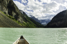 stern of a canoe on a mountain lake