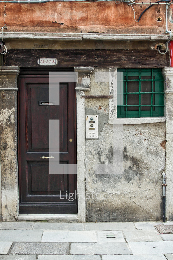 wood door with a mail slot in Venice 