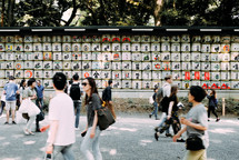 passing people and outdoor art display in Japan 