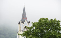 steeple in a foggy sky 