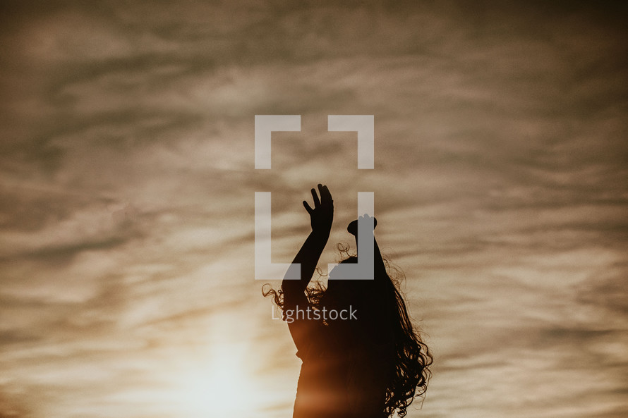 silhouette of a girl jumping up 