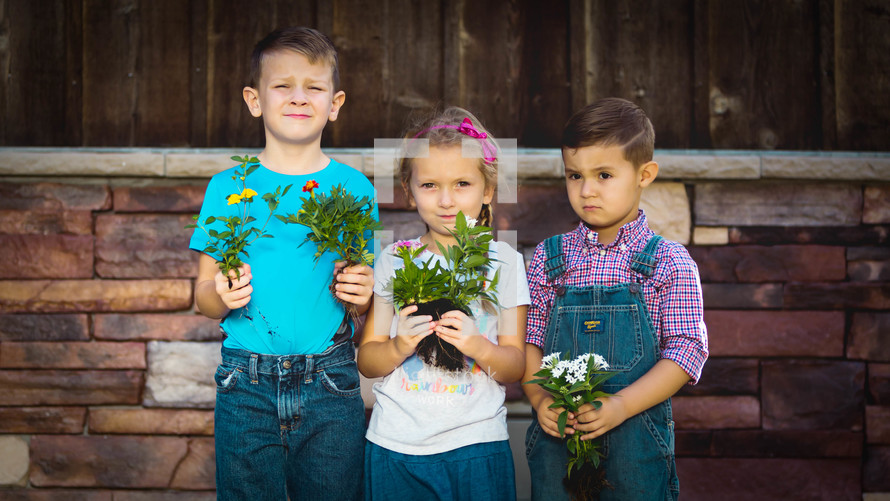Kids Holding Plants