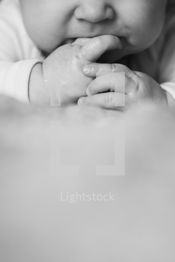 hands of an infant boy
