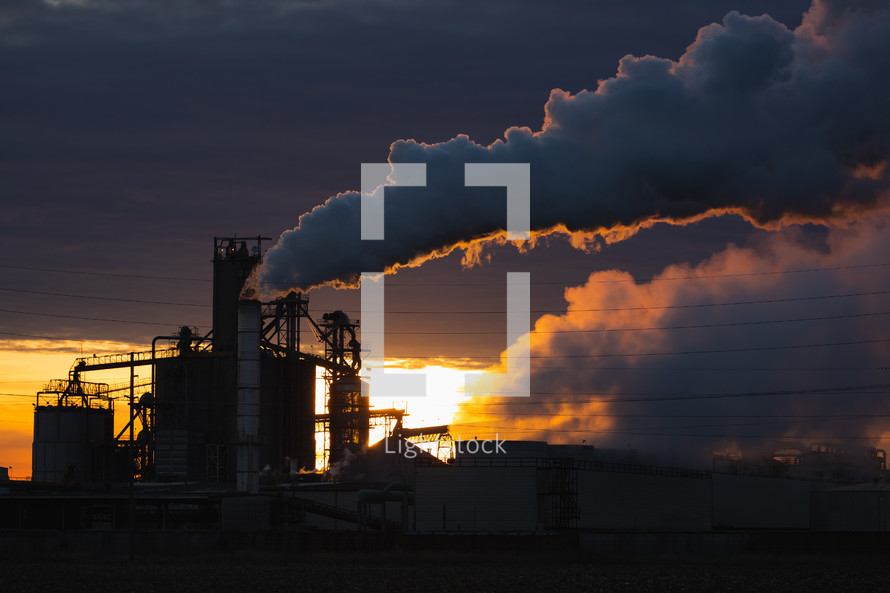 Industrial smoke/pollution during sunset.