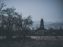 rural church with mountains in the background 