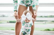 mother and baby daughter in matching outfits 