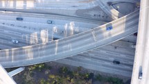 Aerial Drone Flight top down View of freeway busy city rush hour heavy traffic jam highway.