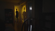 man entering a glowing door 