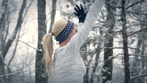 a woman exercising in the snow 