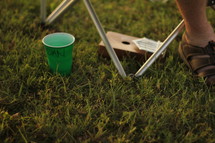 name on a plastic cup in the grass