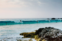 surfers on the waves in Kua Bay 