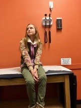 A child waiting at the doctors office 