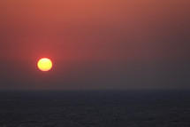 Red sunrise over the ocean.