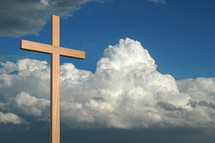 Wooden cross in the clouds.