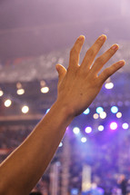hand raised in worship  at a conference