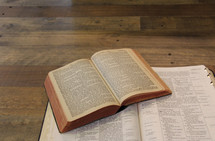 open Bibles stacked on top of each other 