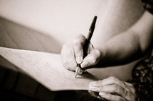 woman writing with a pen