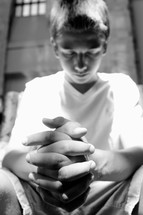 teen boy praying