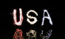 USA written in red, white and blue fireworks
