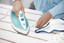 a woman ironing clothes 