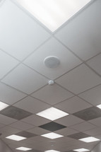 speaker and smoke alarm in a ceiling 