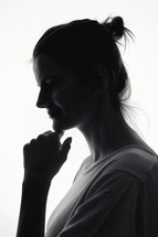 Closeup Profile Of A Woman Silhouette Isolated in Studio