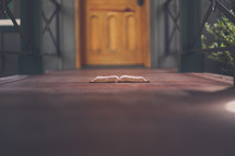 open Bible in a doorway 