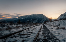 Snowy train tracks in Canadian mountains.