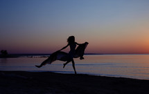 dancer on a beach at sunset 