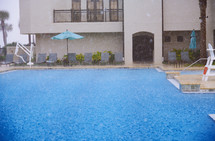 rain at a resort pool 