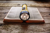flashlight on a Bible 