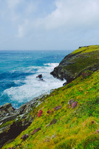 green cliffs along a shore 