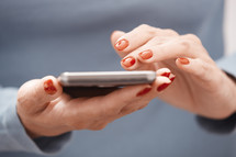 a woman texting on a phone 