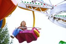 a woman on an amusement park ride 