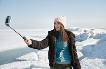 a woman taking a selfie in winter 