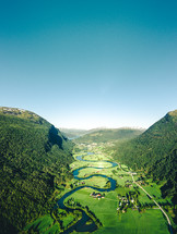 winding river through a green valley 