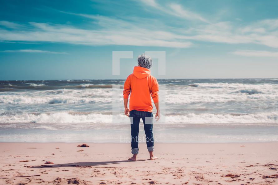 person standing on a beach 