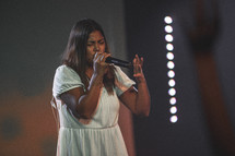 female singing during a worship service 