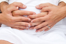 hands on a pregnant belly 
