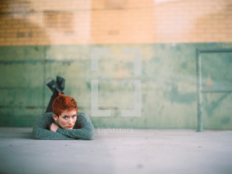 model, woman, lying down, sidewalk, redhead, outdoors, posing, short hair 