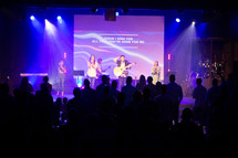 worship leaders playing worship music on stage 